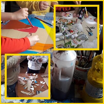 Os alunos pintam a base de cartão enquanto outros recortam as embalagens de sumo compal e outros recortam pormenores de papelão para compor a máscara.
